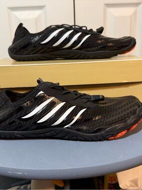 Women's Black Slip-On Athletic Sneakers with White Stripes